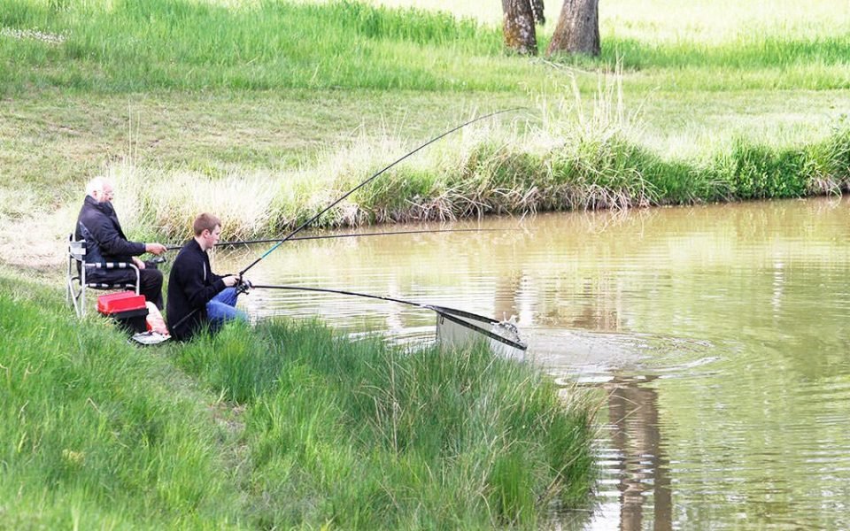 A boy fishing at one of our well stocked fishing pools.