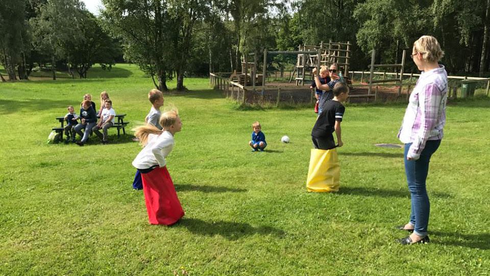 Children in a sack race at Lodge Coppice holiday Park