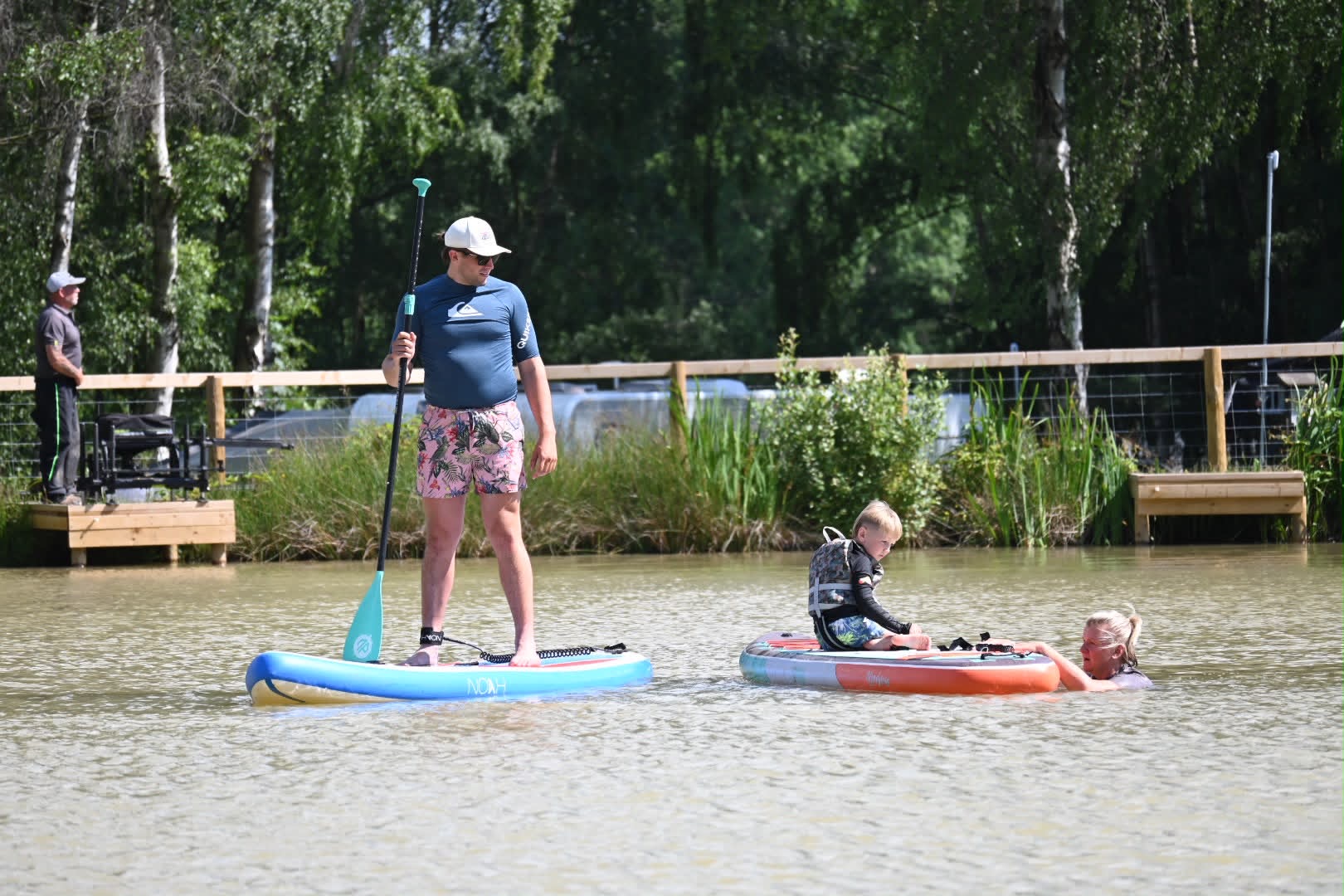 526c2ef6-c1e6-4745-90e5-acdf860f7e21 Adults and child using the non-motorised water sports lake