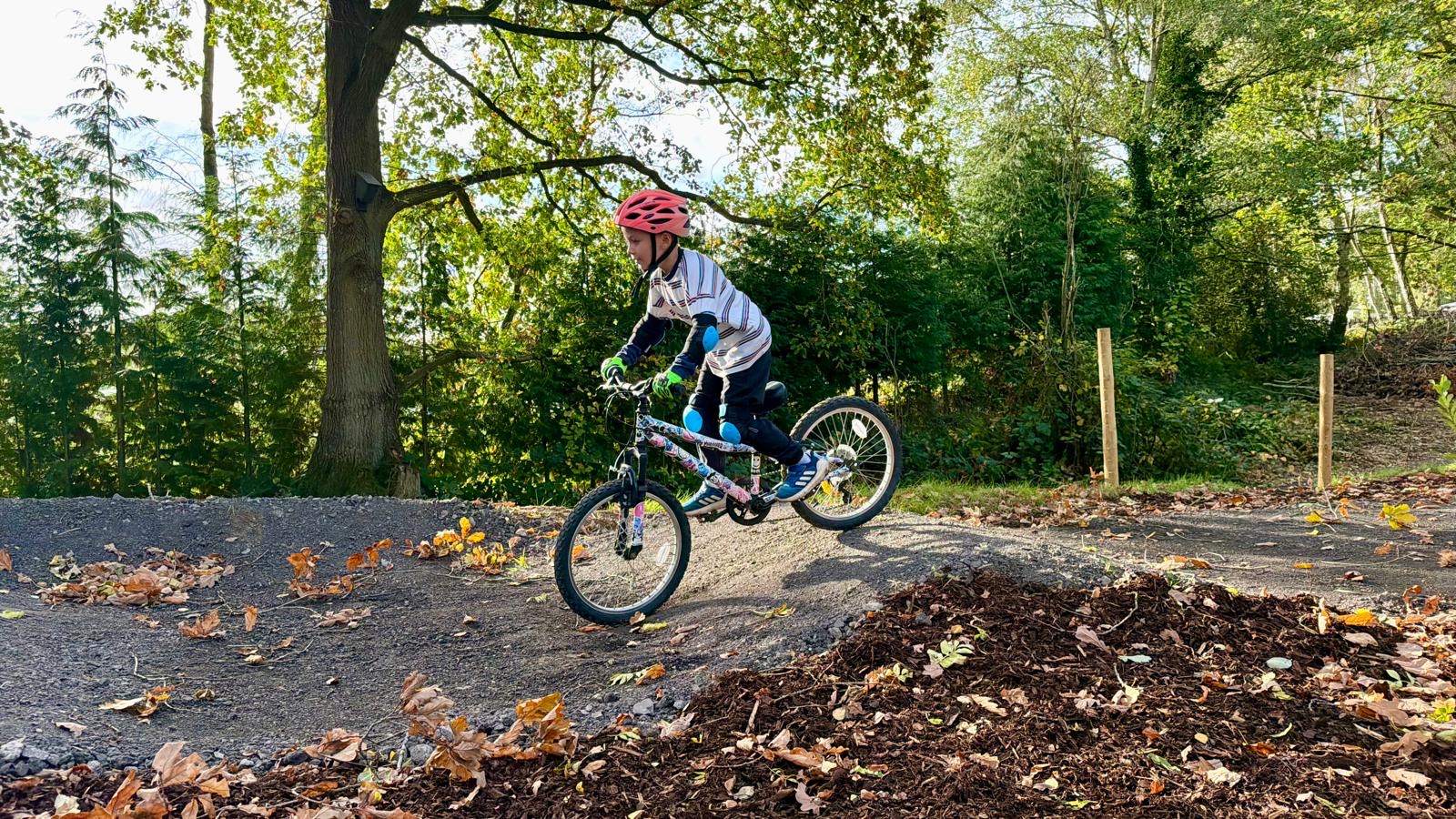 Young child tackling the pump track